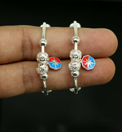 Sterling silver adjustable charm bangle bracelet with tribal design, unisex kids and baby jewelry by Tribal Ornaments.