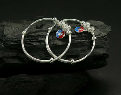 Unisex 925 sterling silver adjustable charm bangle bracelet with tribal design, suitable for kids and babies.