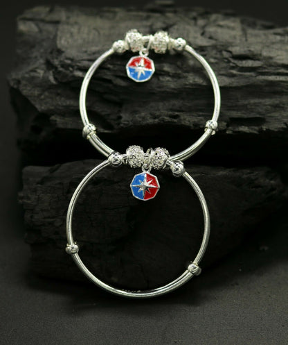 Unisex 925 sterling silver adjustable charm bangle bracelet with tribal design for kids and babies by Tribal Ornaments.