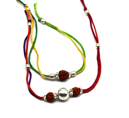 925 sterling silver custom design combo 2-piece Rudraksha beads bracelet by TRIBAL ORNAMENTS featuring thread closure and intricate detailing.