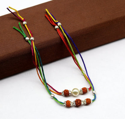 925 sterling silver custom design combo bracelet with Rudraksha beads, featuring a thread rakhi from Tribal Ornaments.