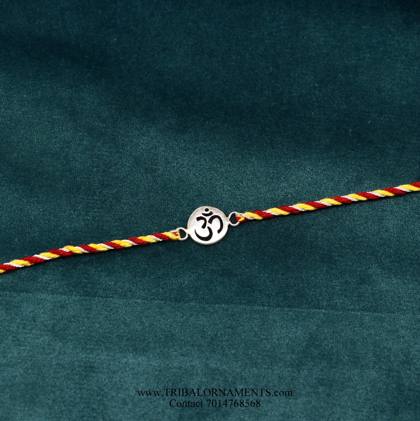 Sterling silver handmade AUM design thread bracelet by TRIBAL ORNAMENTS with intricate tribal-style detailing.