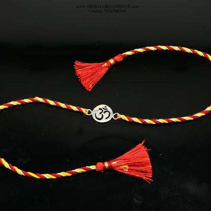Sterling silver handmade AUM design thread bracelet by TRIBAL ORNAMENTS with intricate tribal pattern and stylish finish.