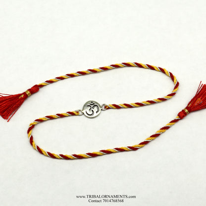 Sterling silver handmade AUM design bracelet by TRIBAL ORNAMENTS, featuring intricate thread craftsmanship and stylish details.