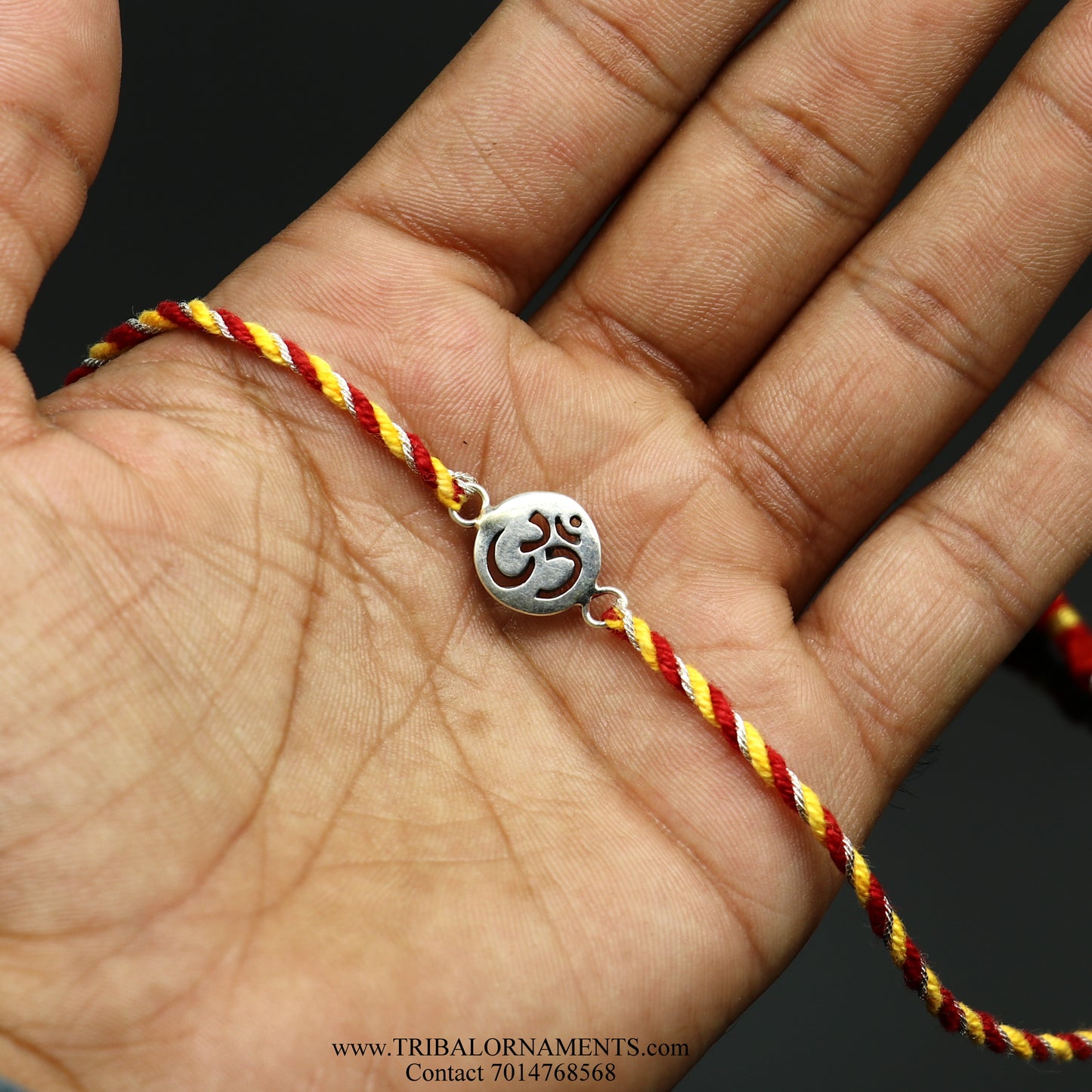 Sterling silver handmade AUM design thread bracelet by TRIBAL ORNAMENTS with intricate tribal pattern and stylish craftsmanship.