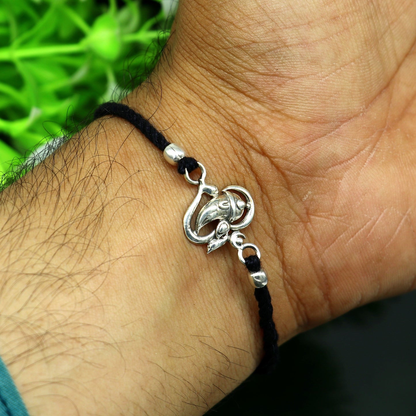 925 sterling silver Om with Ganesha design bracelet from Tribal Ornaments, featuring intricate thread rakhi craftsmanship.