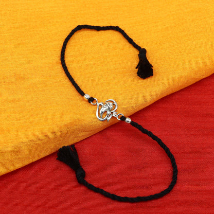 925 sterling silver Om and Ganesha design bracelet from Tribal Ornaments, featuring intricate thread Rakhi style craftsmanship.
