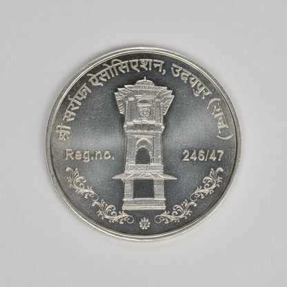 999 silver purity Ganesha, Lakshmi, Saraswati coins for Diwali, 50 grams, featuring intricate religious designs by Tribal Ornaments.