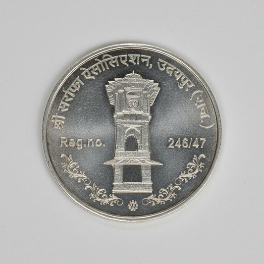 999 silver purity Ganesha, Lakshmi, Saraswati coins for Diwali, featuring detailed religious symbols in a 50 gram coin from Tribal Ornaments.