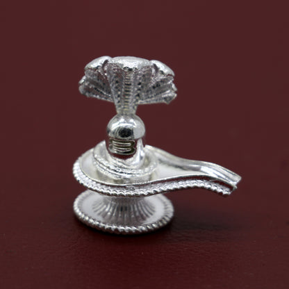 Small 1.2-inch handmade sterling silver Lord Shiva lingam stand for puja, symbolizing wealth and prosperity, crafted by TRIBAL ORNAMENTS.