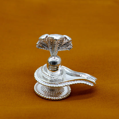 Small 1.2-inch sterling silver Lord Shiva lingam stand, handcrafted by Tribal Ornaments for puja and prosperity rituals.