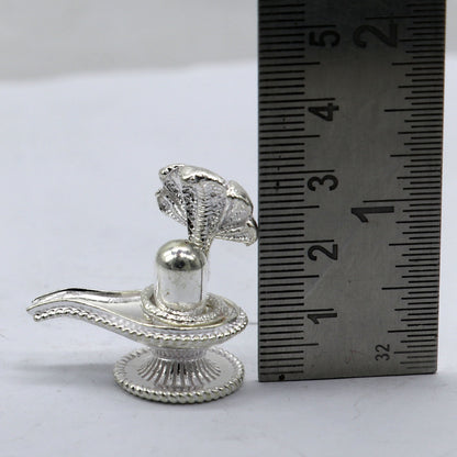 Small solid 925 sterling silver Lord Shiva lingam stand, handmade for puja, representing wealth and prosperity by Tribal Ornaments.