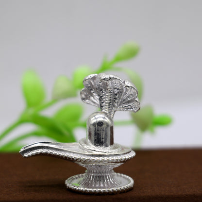 Handmade 1.2-inch sterling silver Lord Shiva lingam stand, a small solid Shivling for puja, wealth, and prosperity decor.