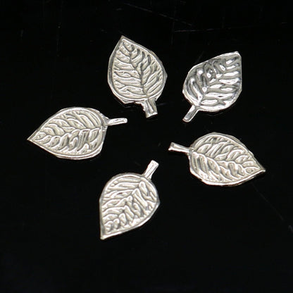 Small 1.3cm sterling silver basil rosary leaf pendant crafted by TRIBAL ORNAMENTS, featuring a detailed tulsi patra design.