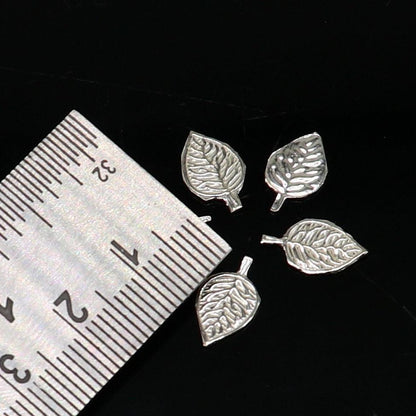 Small 1.3cm handmade sterling silver basil rosary leaf pendant, featuring detailed Tulsi Patra design for worship and spiritual use.