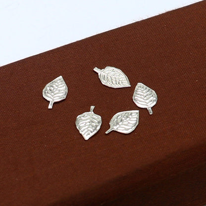 Small 1.3cm handmade sterling silver basil rosary leaf pendant by TRIBAL ORNAMENTS, featuring detailed tulsi patra design for worship.