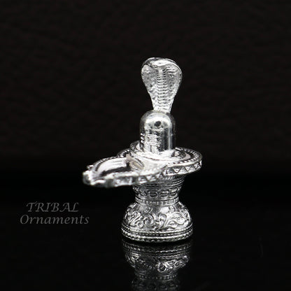 Small 1-inch handmade sterling silver Lord Shiva Lingam stand for puja, symbolizing wealth and prosperity, crafted by TRIBAL ORNAMENTS.