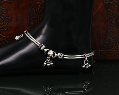 Vintage 10.5-inch sterling silver snake-style anklet with hanging bells, handcrafted tribal foot jewelry with antique design.