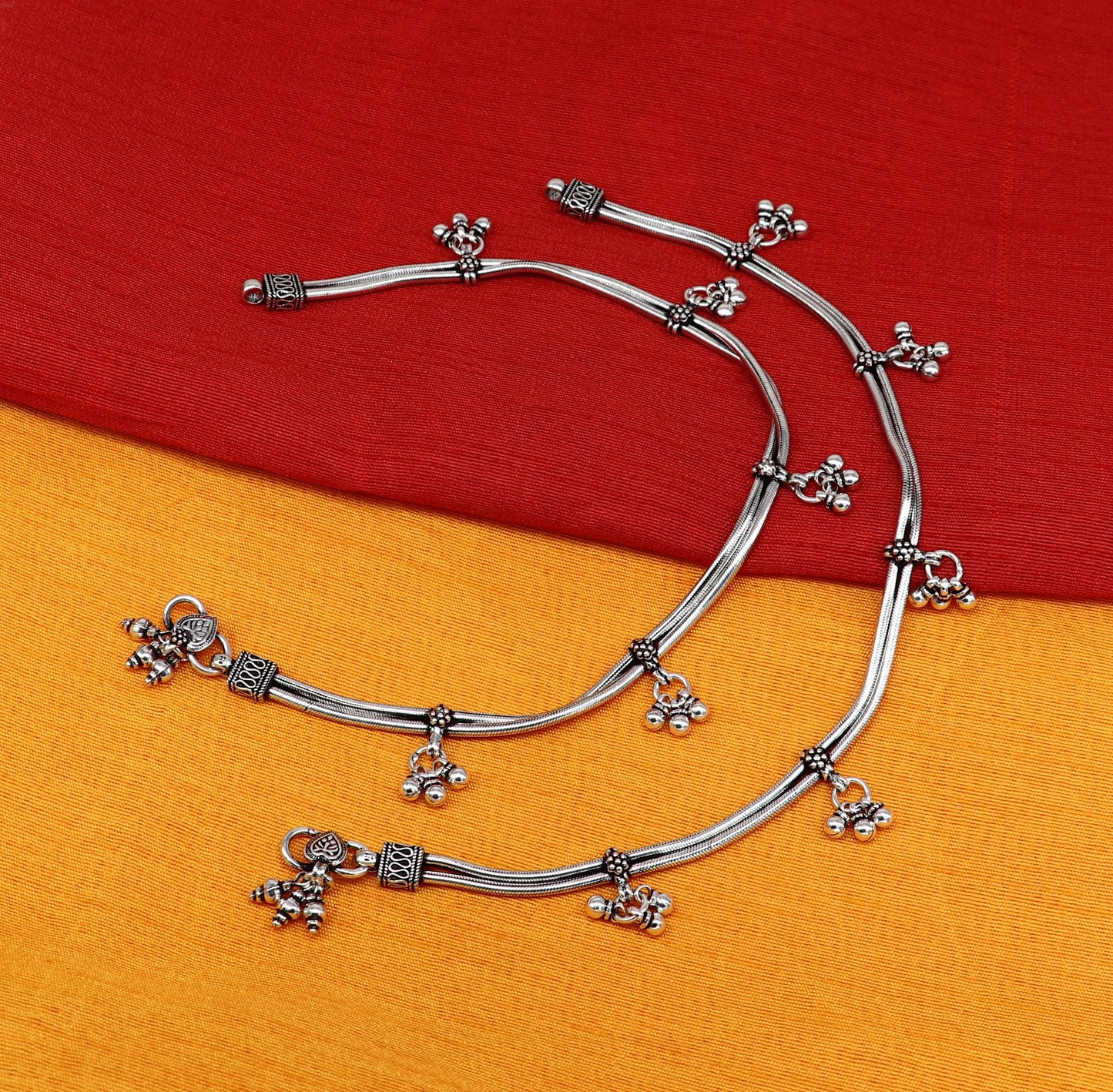 Sterling silver vintage snake-style anklet with hanging bells, handmade tribal foot jewelry for ankle or belly adornment.