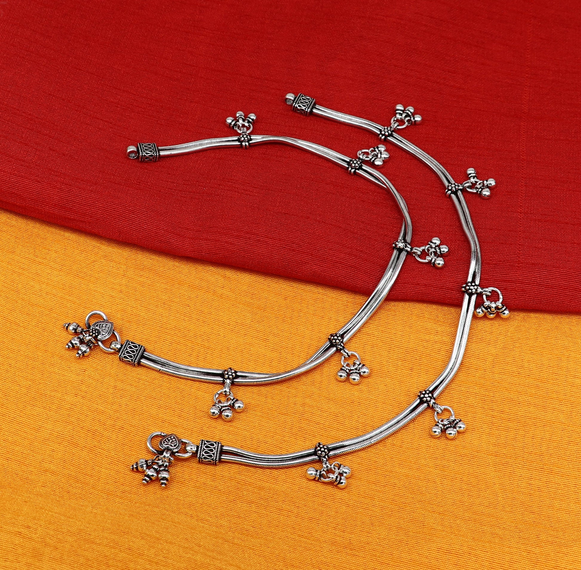 Sterling silver vintage snake-style anklet with hanging bells, handmade tribal foot jewelry for ankle or belly adornment.