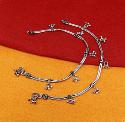 Sterling silver vintage snake-style anklet with hanging bells, handmade tribal foot jewelry for ankle or belly adornment.