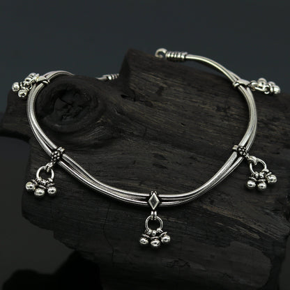 Sterling silver 10.5-inch vintage-style snake chain anklet with hanging bells, handcrafted tribal jewelry for the ankle.