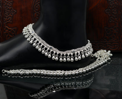 Sterling silver double chain anklet with waved jingle bells and charms, perfect for belly dance and ankle jewelry.