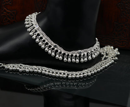 Sterling silver double chain anklet with waved jingle bells, charm design, perfect for belly dance jewelry on ankles and feet.