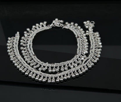Sterling silver double chain anklet with waved jingle bells and charm, designed for ankles and feet, perfect for belly dance jewelry.