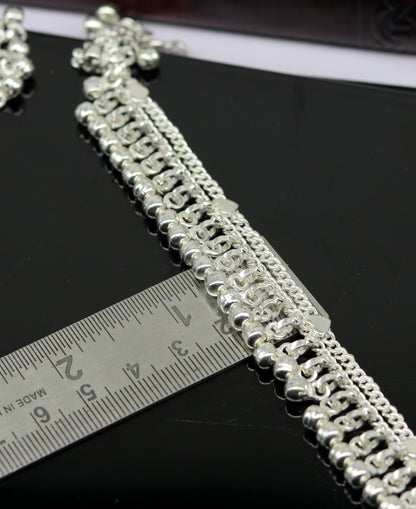 Sterling silver double chain anklet with waved jingle bells and charm, ideal for belly dance jewelry and ankle decoration.