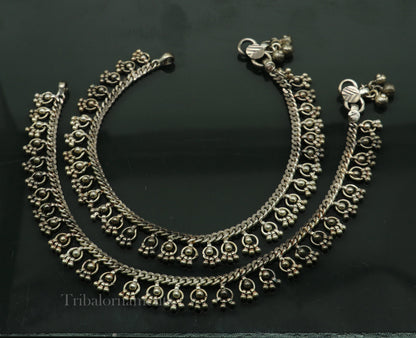 Vintage 10.5-inch sterling silver anklet with handmade tribal charm, ethnic tribal jewelry, worn and antique-style.