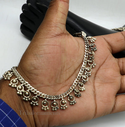 Vintage 10.5-inch sterling silver anklet with tribal charm, handmade antique tribal jewelry, worn on the ankle.