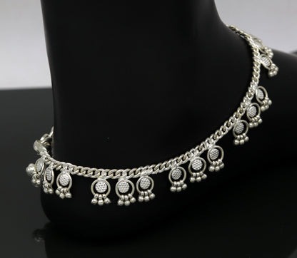 Handmade 10-inch sterling silver ankle bracelet with tiny drop charms, crafted by TRIBAL ORNAMENTS for stylish, customizable jewelry.