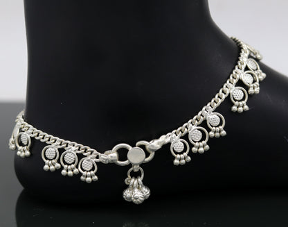 Handmade 10-inch sterling silver ankle bracelet with tiny drop charms, crafted by TRIBAL ORNAMENTS for stylish customized gifting.