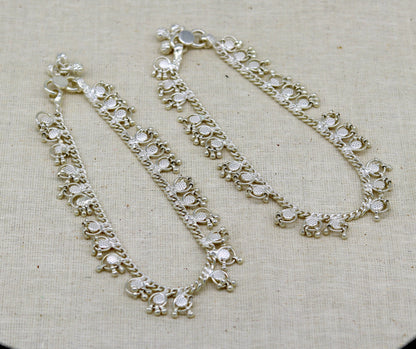 Handmade 10-inch sterling silver ankle bracelet with tiny drop charms, crafted by TRIBAL ORNAMENTS, ideal for custom gift jewelry.