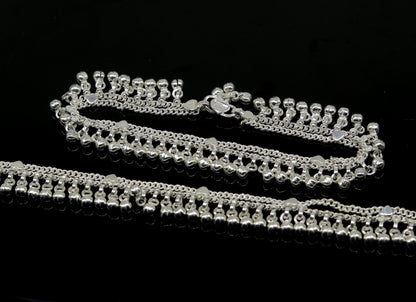 Sterling silver 10-inch double chain anklets with waved jingle bells and charms, tribal-inspired belly dance jewelry from TRIBAL ORNAMENTS.
