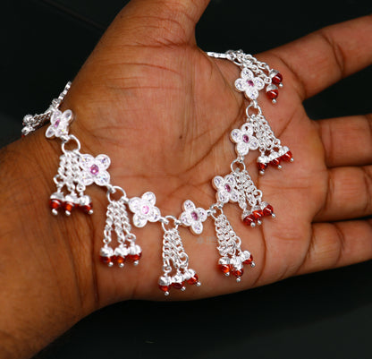 Sterling silver vintage ankle bracelet with handmade chain and dangling ornament, featuring genuine jewelry details and tribal style.