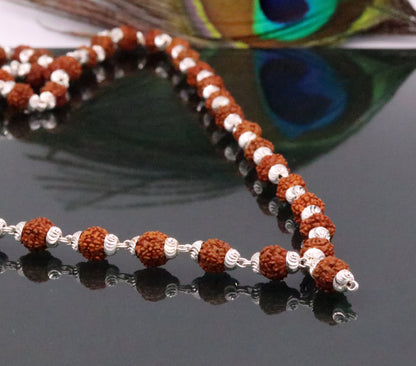 Handmade sterling silver Japp mala necklace with 108 natural Rudraksh beads, 54 inches long from Rajasthan, India.