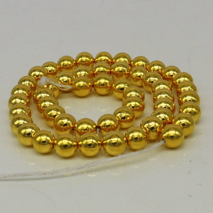 10pcs 22kt yellow gold handmade 7mm plain beads for jewelry making, featuring loose waxed beads and jewelry findings by TRIBAL ORNAMENTS.