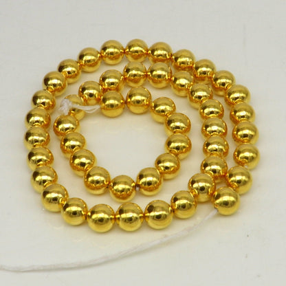 10pcs 22kt yellow gold handmade 7mm plain beads for jewelry making, featuring loose waxed beads and gold findings.