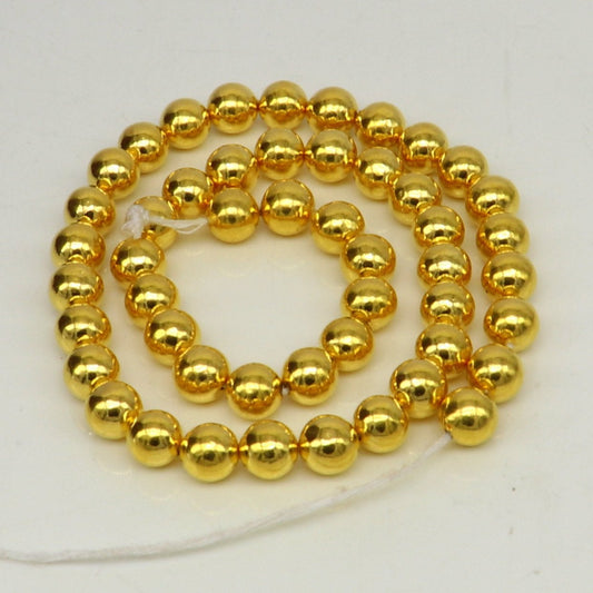 10pcs 22kt yellow gold handmade 7mm plain beads for jewelry making, featuring loose waxed beads and gold findings.