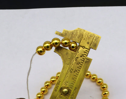 Set of 10 handmade 7mm 22kt yellow gold plain beads by TRIBAL ORNAMENTS, suitable for custom gold jewelry making.