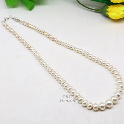 Freshwater pearl necklace set by Tribal Ornaments with 4-9mm pearls, single-layer string, ideal for weddings or daily wear jewelry.