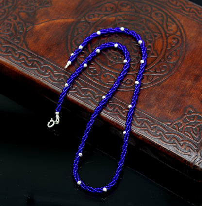 Sterling silver galaxy necklace with triple strands of blue semi-precious stone beads and silver bead accents, by TRIBAL ORNAMENTS.