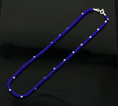 Sterling silver galaxy necklace with triple strands, blue semi-precious stone beads, and silver accents from TRIBAL ORNAMENTS.