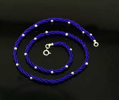 18.5-inch sterling silver galaxy necklace set with triple strands of blue semi-precious stone beads and silver accents.