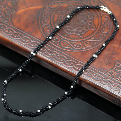 18-inch TRIBAL ORNAMENTS silver galaxy necklace with triple strands, semi-precious black cut stone beads, and silver accents.