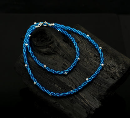 Sterling silver galaxy necklace with triple strands of blue semi-precious stone beads and silver accents, crafted by Tribal Ornaments.