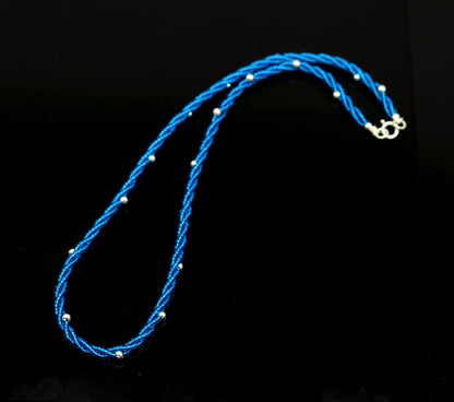Sterling silver galaxy necklace with triple strands of blue semi-precious stone beads and silver accents, by TRIBAL ORNAMENTS.