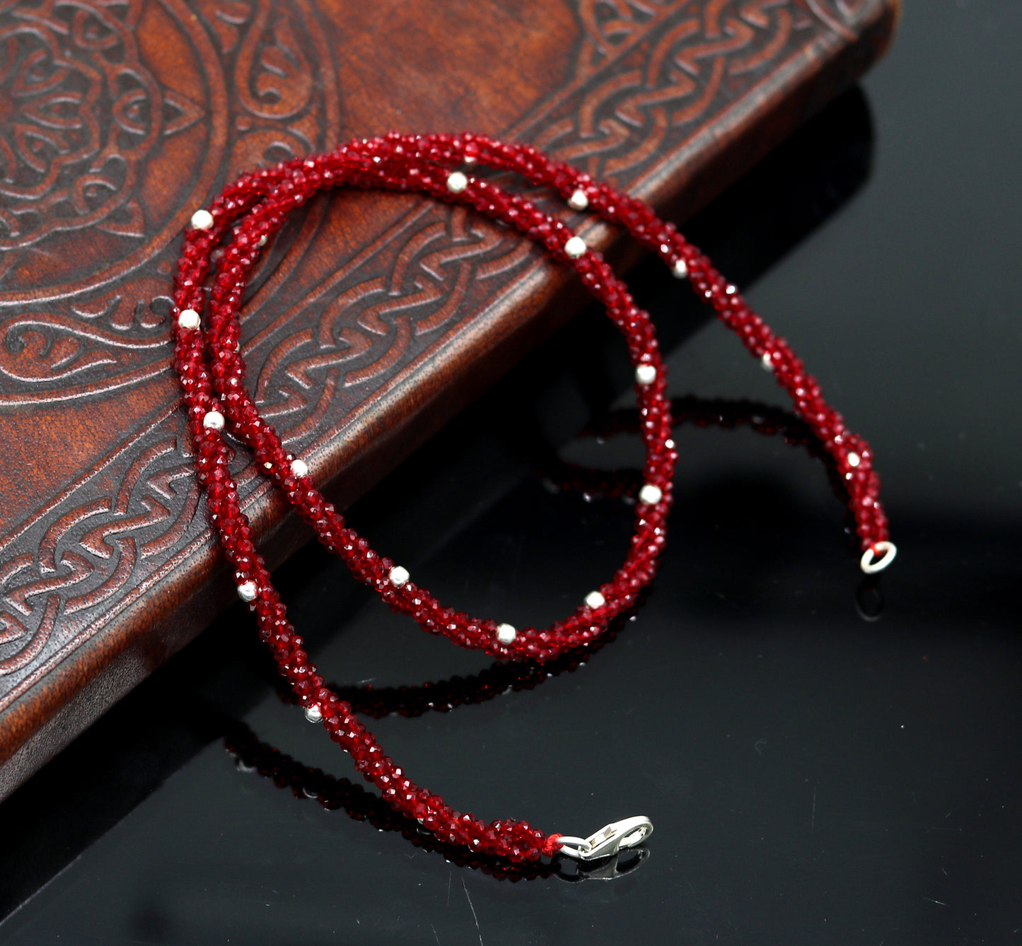 18-inch tribal beaded necklace set with triple strands, semiprecious cut stones, and silver beads, featuring a galaxy-inspired design.